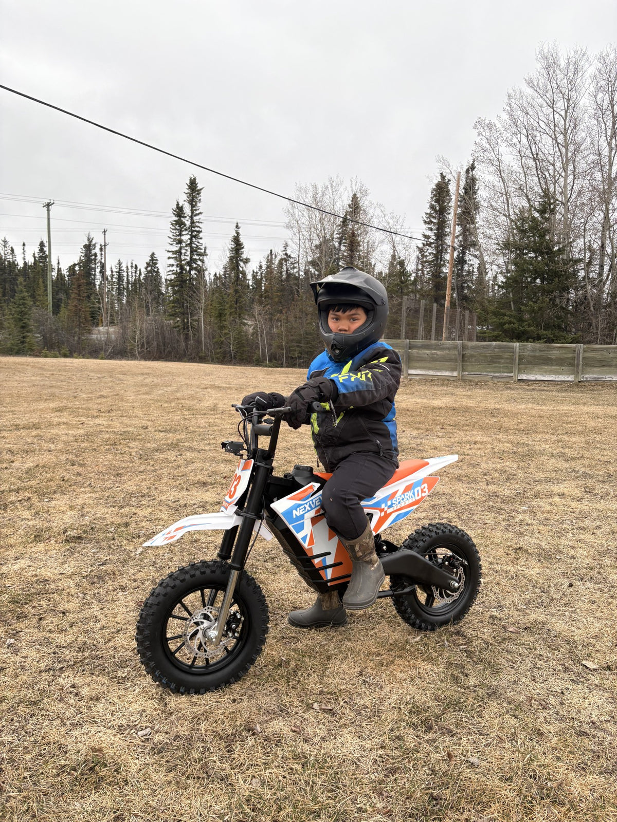 Young rider on a NEXVEY Spark 03 electric dirt bike off road