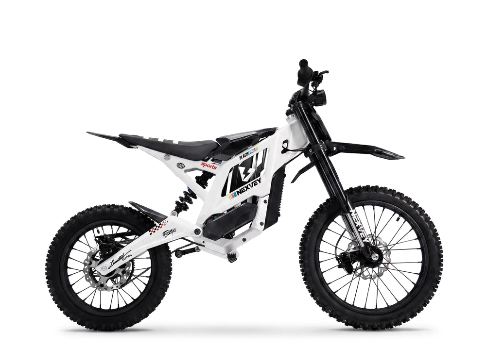 White NEXVEY Flash Pro youth electric motorcycle with off-road tires and full suspension isolated on white background.