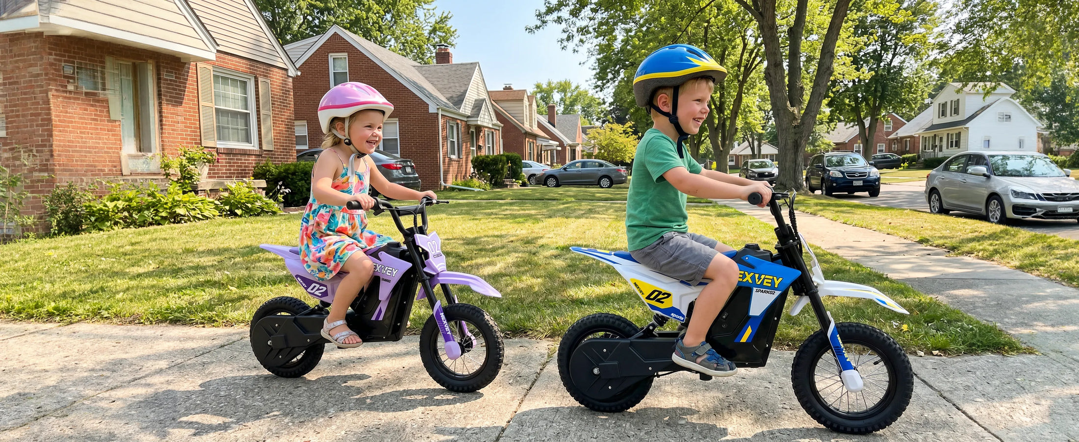 Two children riding blue and purple NEXVEY Spark 02 electric dirt bikes in a residential neighborhood