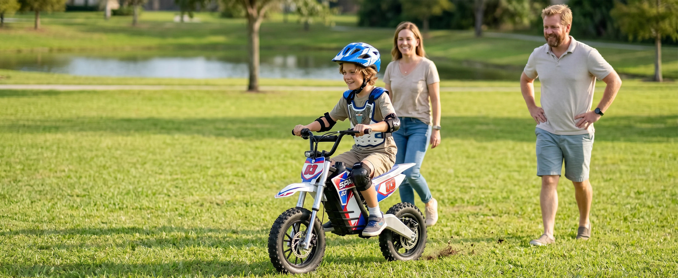 Child riding a NEXVEY Spark 03 Lite electric dirt bike with family outdoors