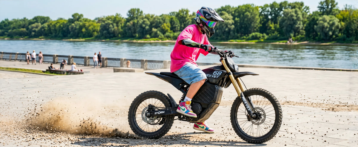Rider on a NEXVEY Storm electric dirt bike beside a lake