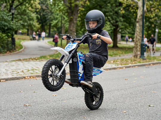 Action shot of a young boy performing a wheelie on a Nexvey Spark 03 electric dirt bike for kids in a park